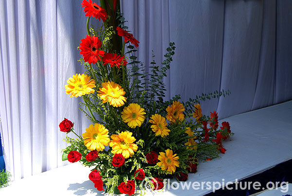 Red and yellow gerbera with red rose bouquet